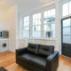 Sofa and large windows in the living room in St Johns Wood